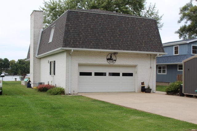 view of front facade with a front yard and a garage