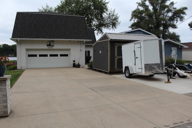 view of front of house featuring a shed and a garage