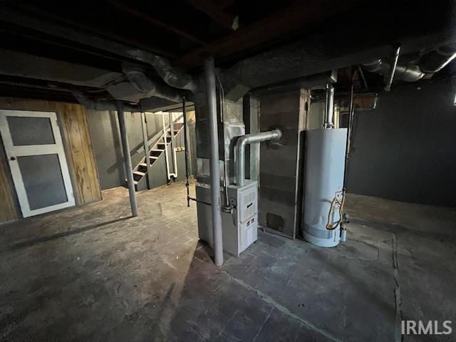 basement with gas water heater and heating unit