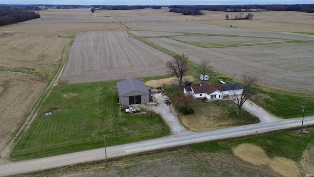 birds eye view of property with a rural view