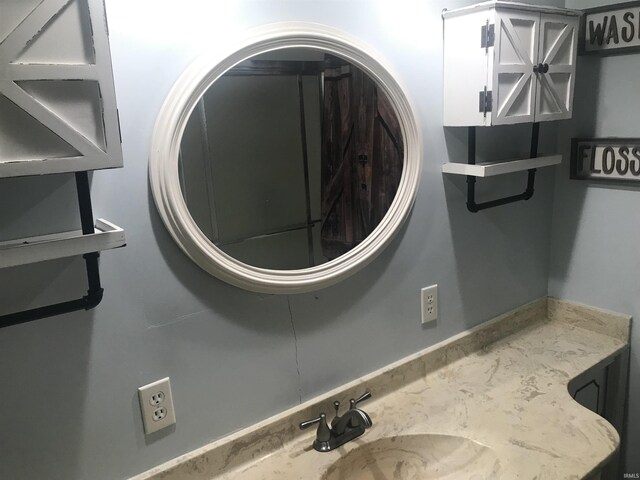 clothes washing area featuring sink