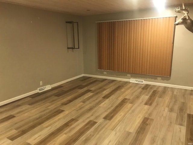 spare room featuring hardwood / wood-style flooring