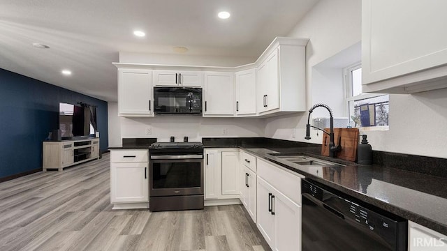 kitchen with white cabinets, light wood-type flooring, sink, and black appliances