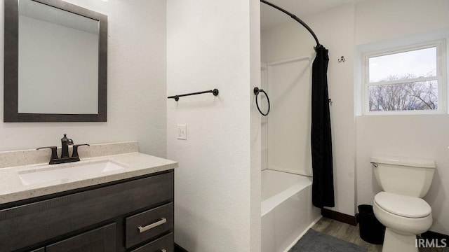 full bathroom featuring hardwood / wood-style flooring, vanity, toilet, and shower / bathtub combination with curtain