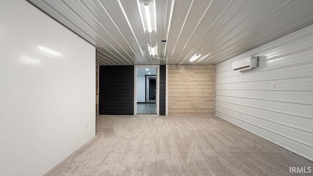 carpeted empty room featuring a wall mounted AC and wooden walls