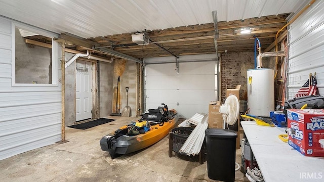 garage featuring gas water heater and a garage door opener