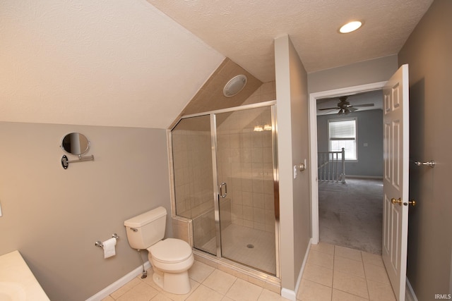 bathroom featuring toilet, tile patterned floors, and an enclosed shower