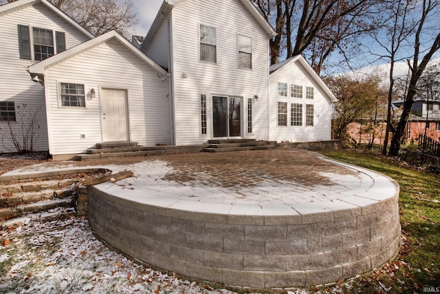 rear view of property featuring a patio