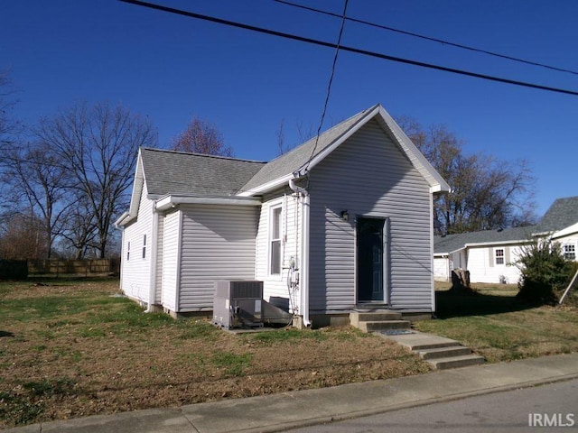 bungalow-style house featuring cooling unit