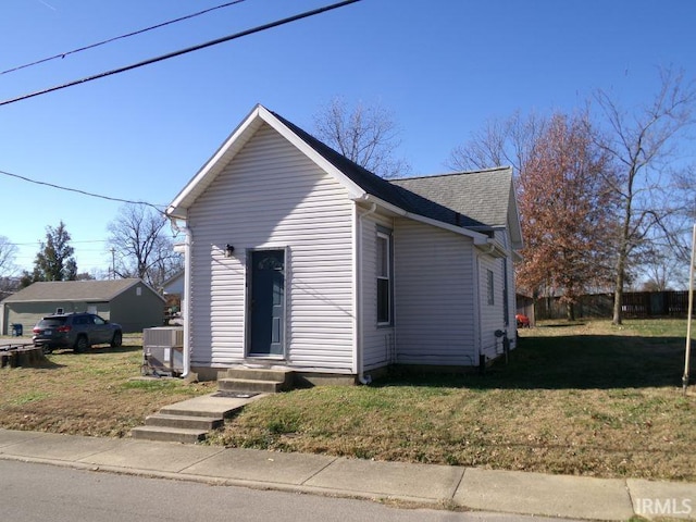 bungalow-style house featuring a front yard