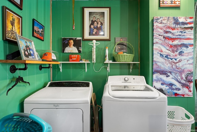 clothes washing area with washing machine and clothes dryer