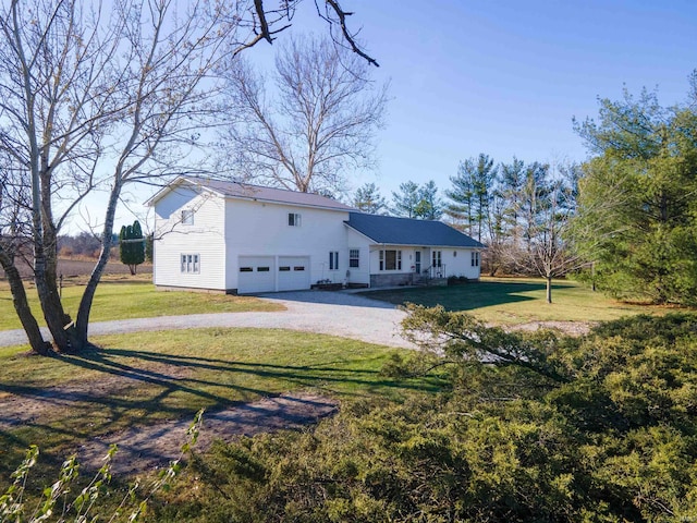 rear view of property featuring a yard