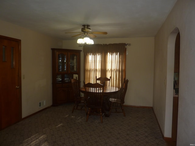 dining room featuring ceiling fan