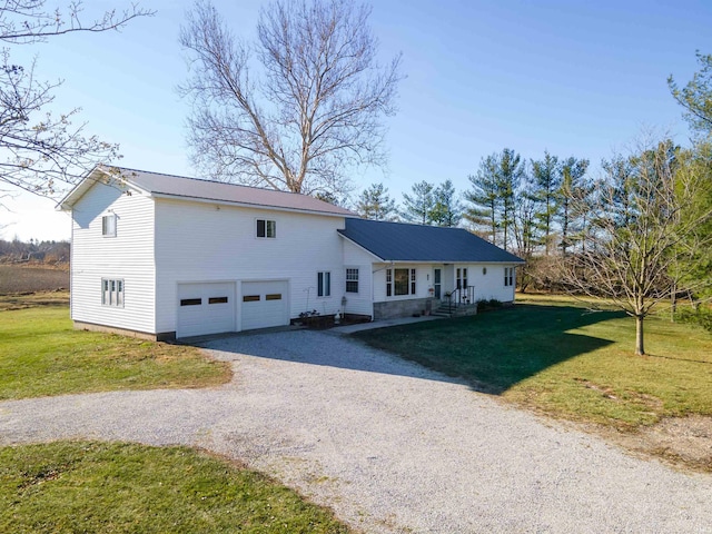 view of front of house with a garage and a front yard