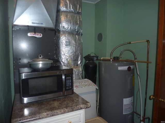 utility room featuring water heater