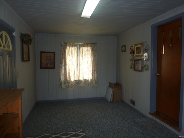 empty room with carpet floors and crown molding