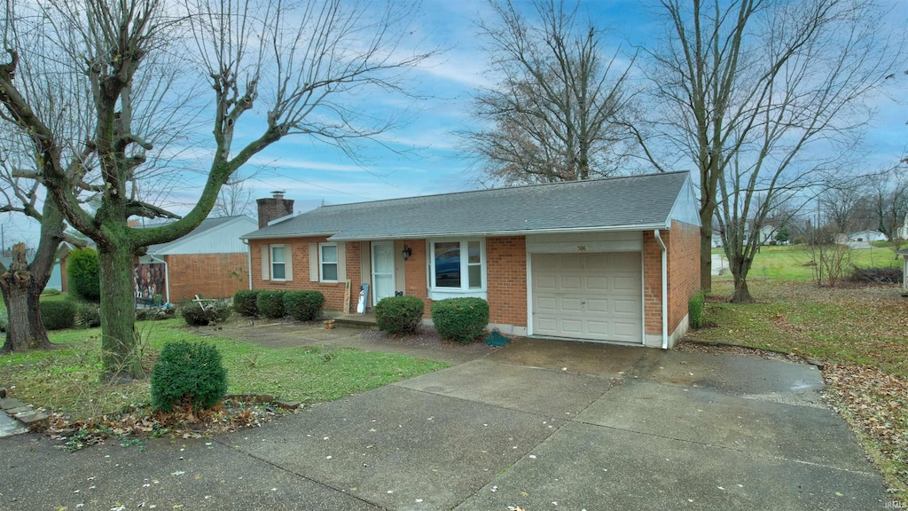 306 S Main St, Dale, IN 47523 - ranch-style house featuring a front yard and a garage