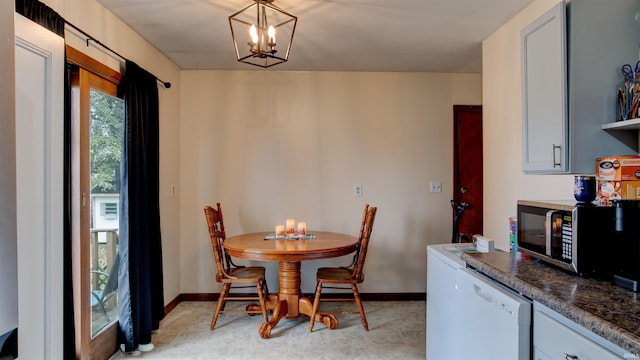 dining area featuring a notable chandelier