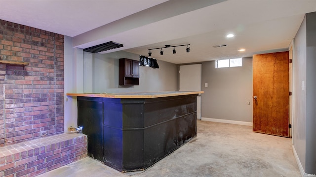 bar featuring dark brown cabinetry