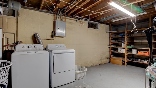 washroom featuring washer and clothes dryer and electric panel