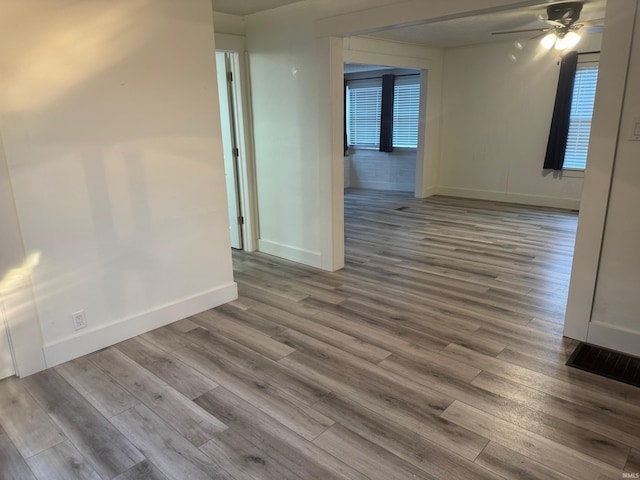 spare room with ceiling fan and hardwood / wood-style floors