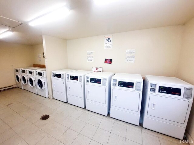 clothes washing area with washing machine and clothes dryer