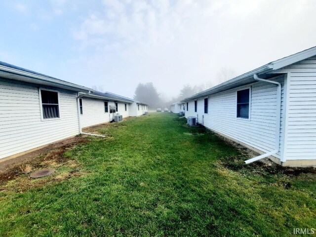 view of yard featuring central AC unit