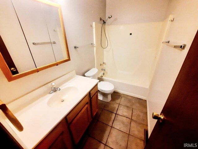 full bathroom featuring tile patterned flooring, vanity, toilet, and tub / shower combination