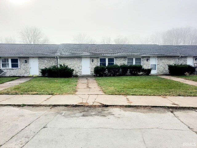 ranch-style house with a front lawn