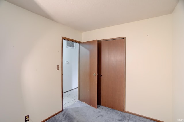 carpeted bedroom with a closet