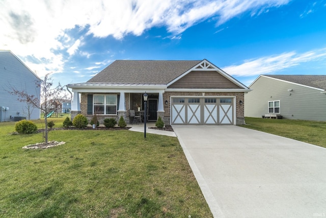 craftsman-style home with a garage and a front lawn