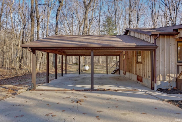 view of parking / parking lot featuring a carport