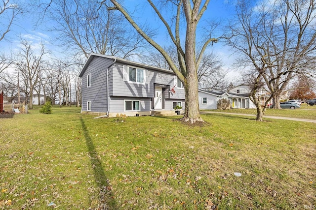 bi-level home with a front lawn