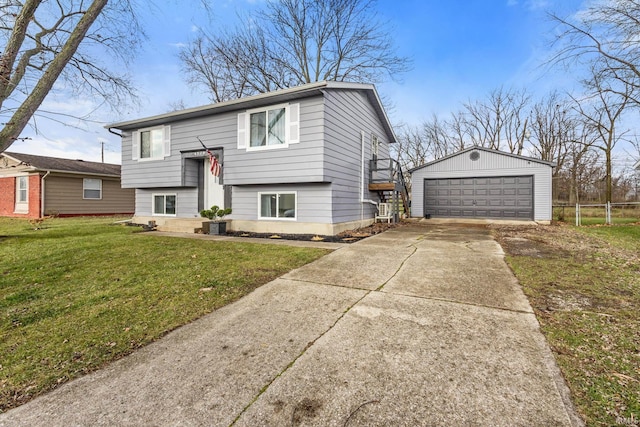 split foyer home with an outbuilding, a front yard, and a garage