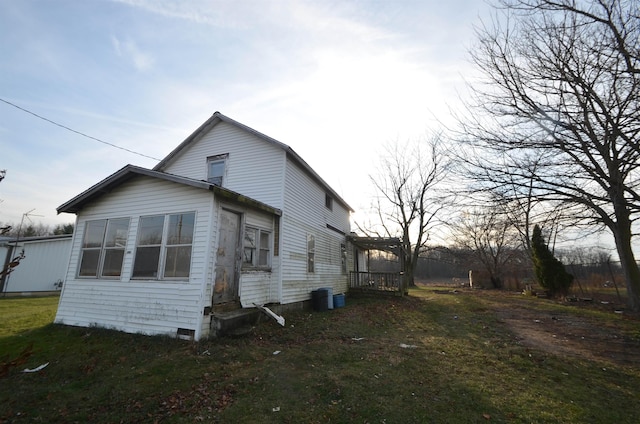 view of property exterior featuring a yard