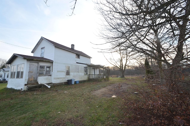 view of property exterior featuring a yard