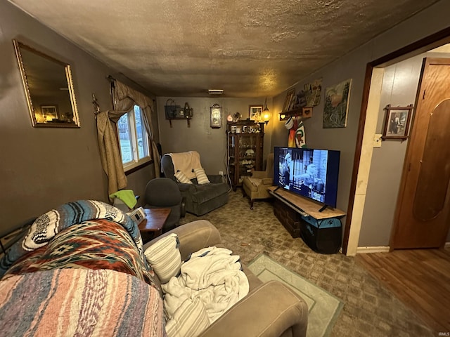 living room featuring a textured ceiling and hardwood / wood-style flooring