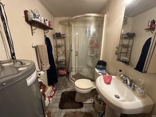 bathroom featuring tile patterned floors, walk in shower, electric water heater, sink, and toilet