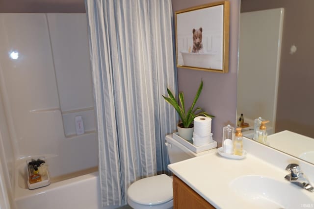 full bathroom featuring shower / tub combo, vanity, and toilet