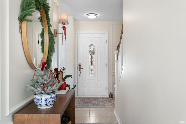 doorway to outside with light tile patterned floors and a textured ceiling