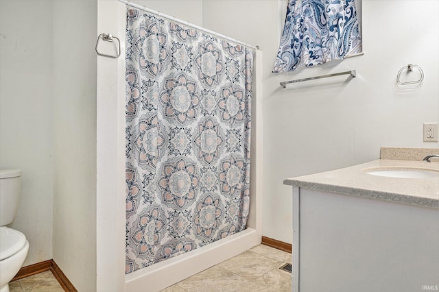 bathroom featuring a shower with shower curtain, tile patterned floors, vanity, and toilet