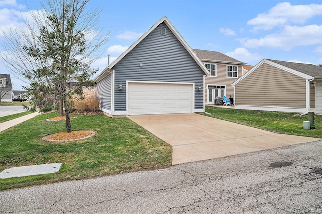 view of front of property with a garage and a front lawn