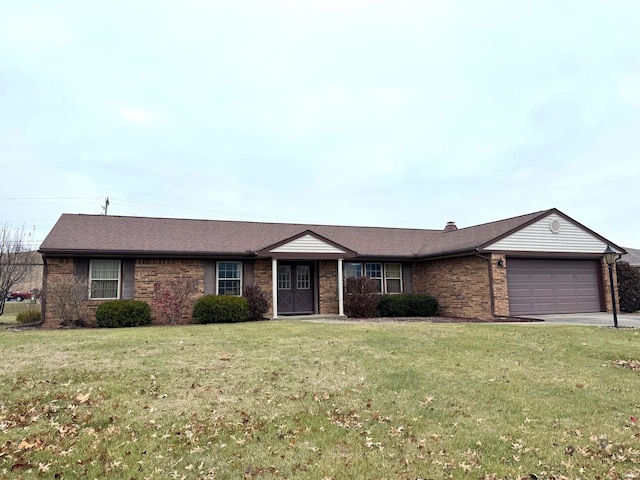 ranch-style home with a garage and a front yard