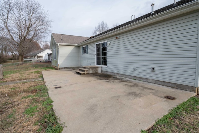 back of property with a patio