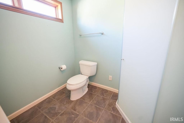 bathroom with tile patterned floors and toilet