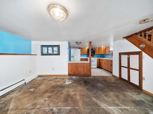 unfurnished living room featuring baseboard heating