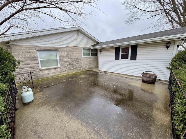 view of side of home featuring a patio