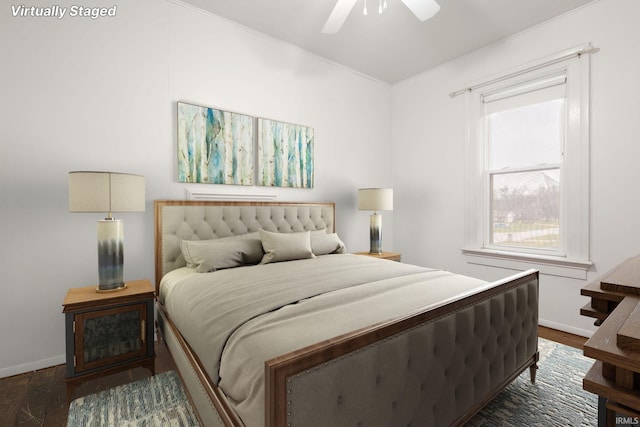 bedroom featuring ceiling fan and dark wood-type flooring