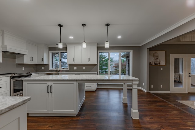 kitchen featuring white cabinetry, dark wood-type flooring, light stone counters, pendant lighting, and electric stove