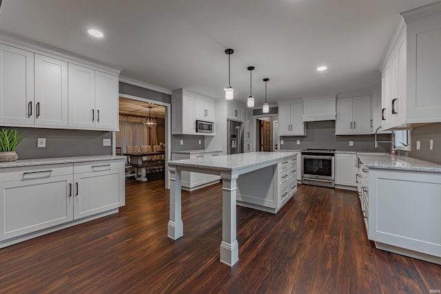 kitchen with white cabinetry, dark hardwood / wood-style flooring, and stainless steel appliances